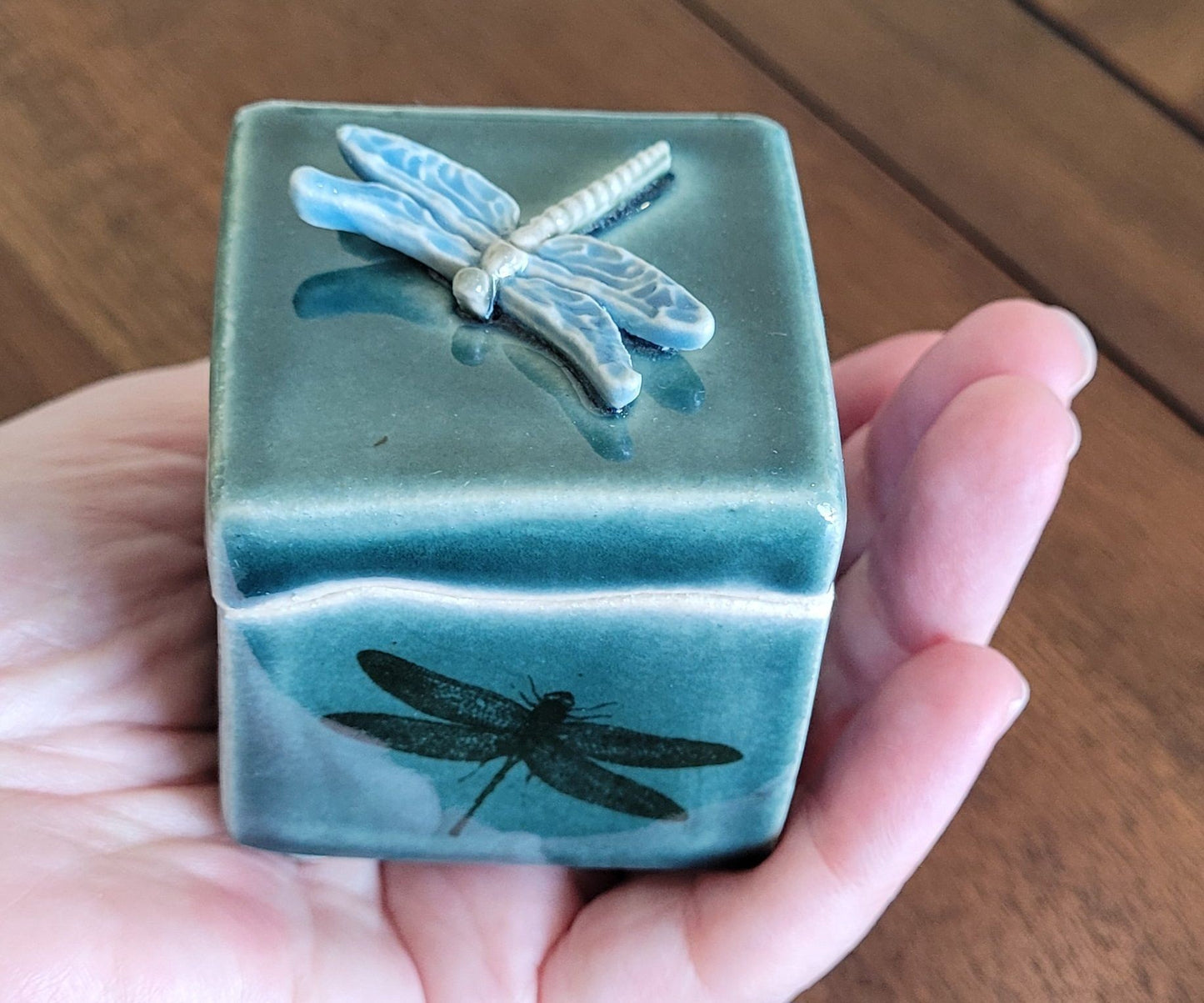 Tiny stoneware treasure box with dragonfly designs and ceramic dragonfly on lid