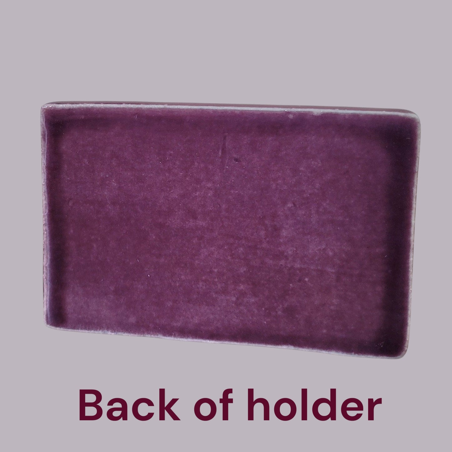 Back of purple rectangular business card holder on a gray background with text 'Back of holder'.