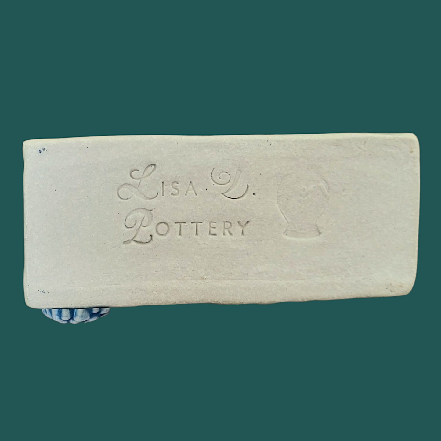 Bottom of business card holder showing the Lisa D Pottery "Maker's Mark"