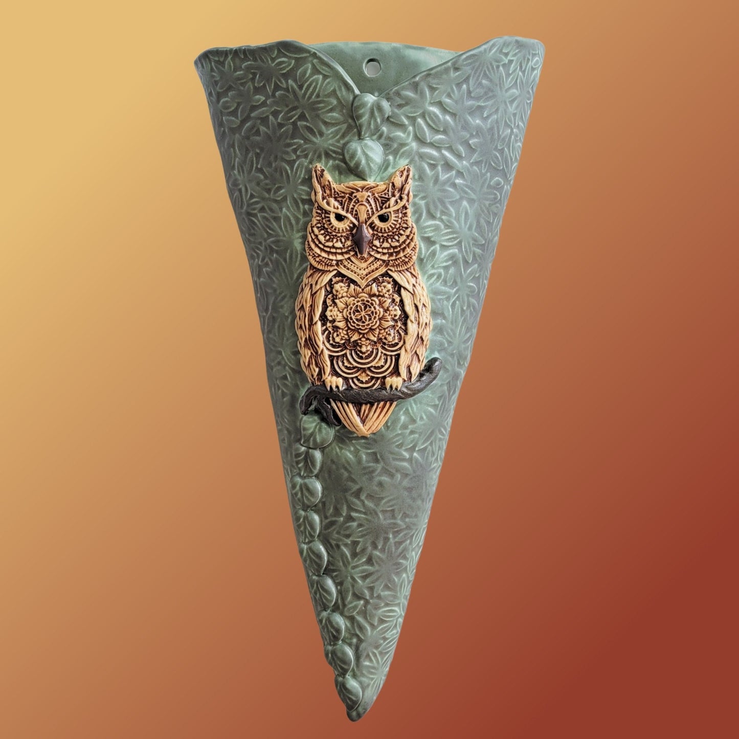 Close-up detail of hand-glazed finish on kiln-fired stoneware owl wall pocket vase