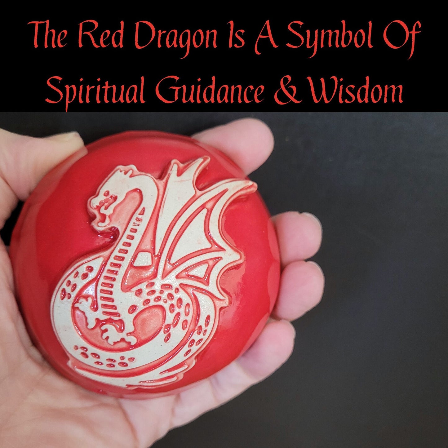 Red dragon meditation rattle held in hand showing size and ergonomic design for comfortable meditation practice use