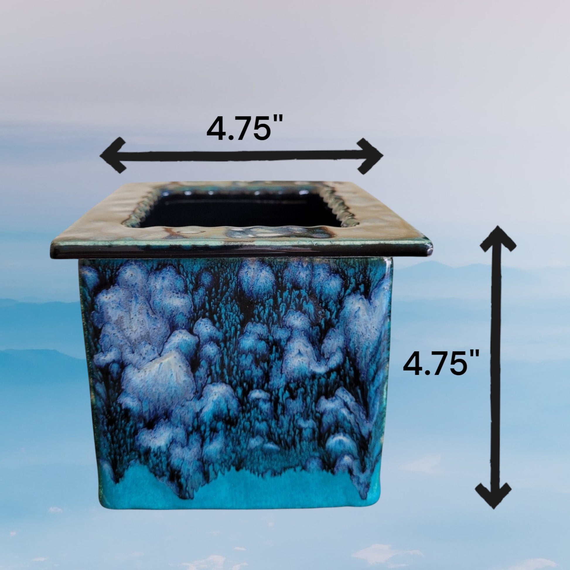 Square succulent pot with blue and dark gray marbled design and dimensions indicated on a light blue background