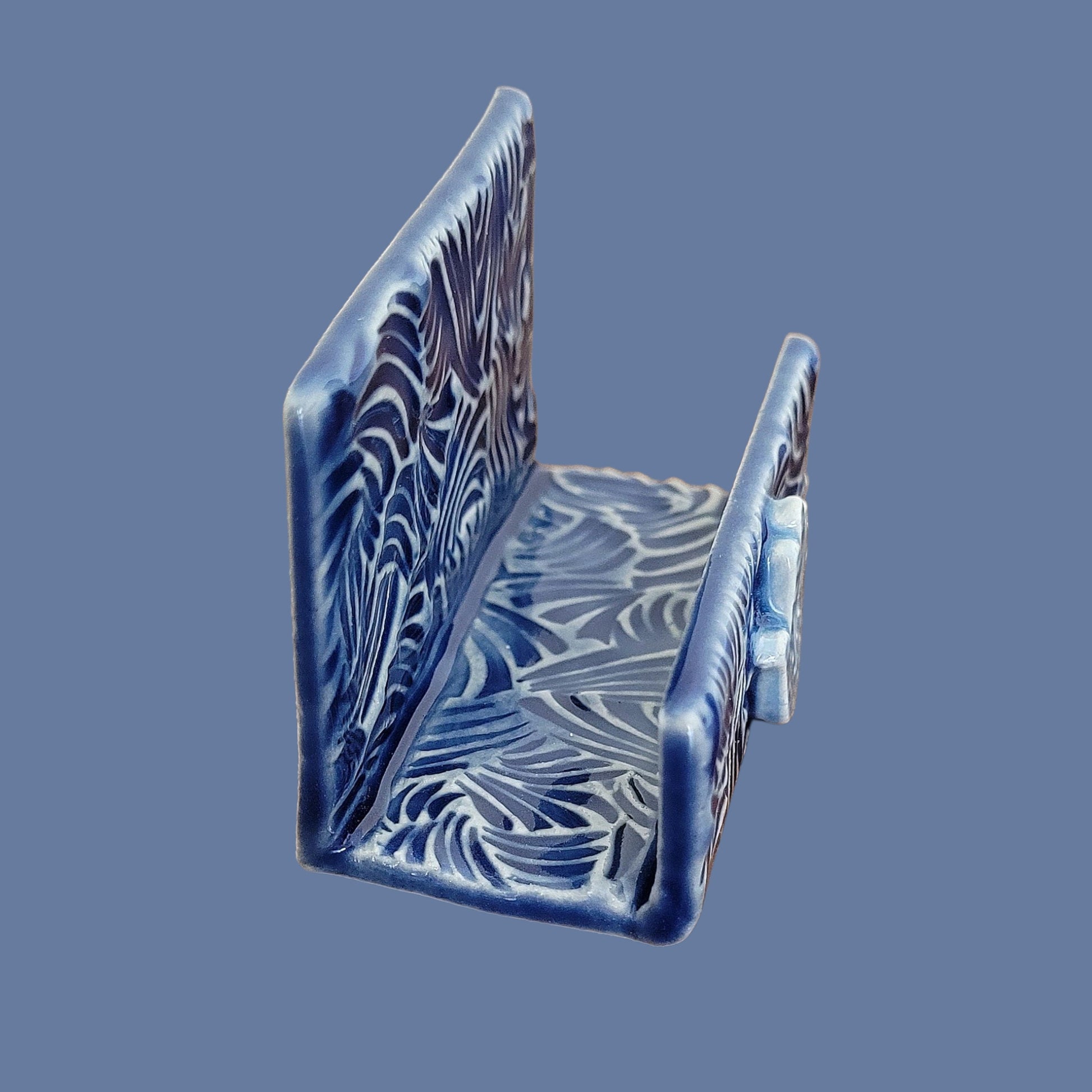 side view of blue and white hamsa hand business card holder