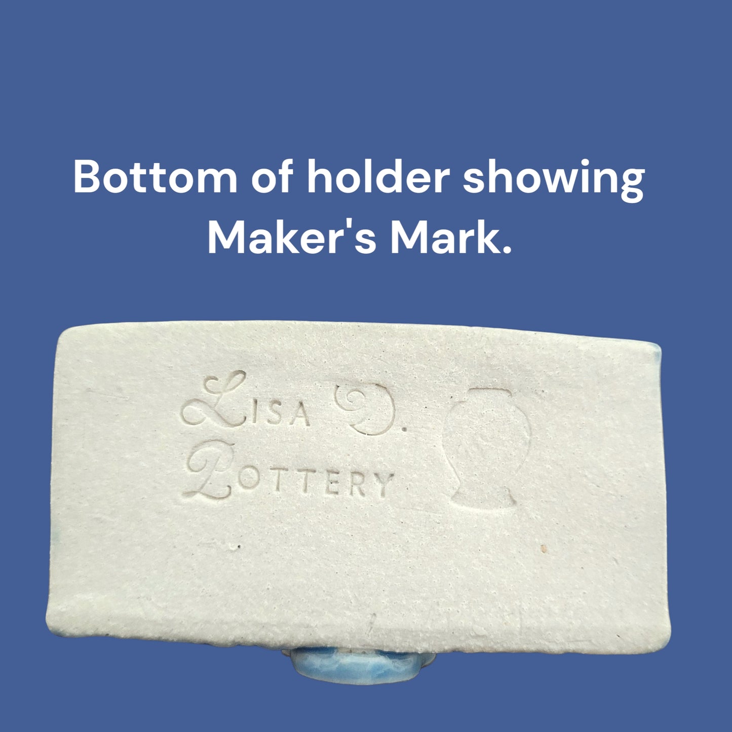 Bottom of ceramic business card holder with 'Lisa Pottery' branding on a blue background