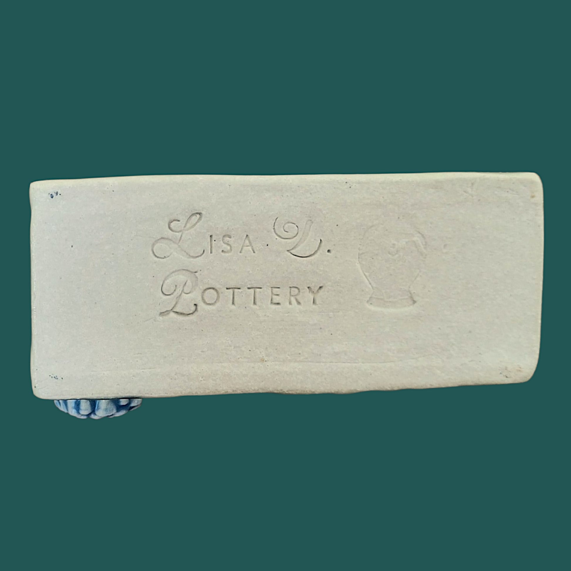 Bottom of business card holder showing the Lisa D Pottery "Maker's Mark"